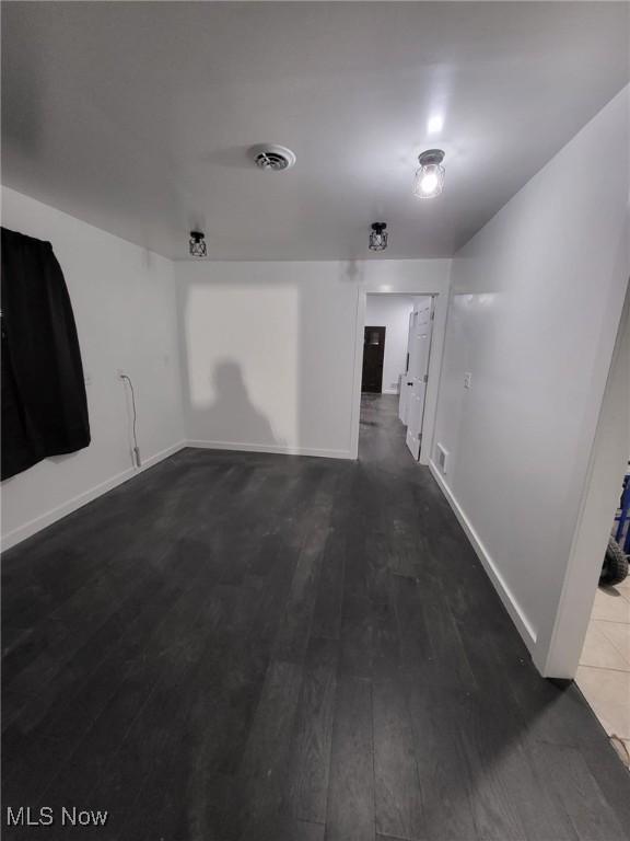 1553 Parkman Rd NW, Warren, OH 44485 - empty room featuring baseboards, wood finished floors, and visible vents
