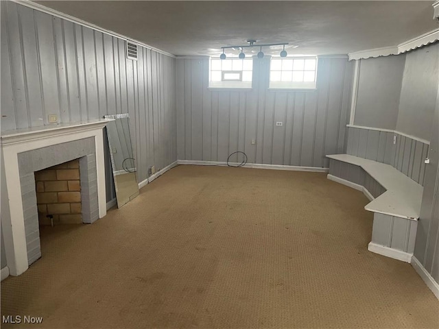 1104 S Belvoir Blvd, South Euclid, OH 44121 - basement featuring visible vents, carpet, a brick fireplace, and baseboards