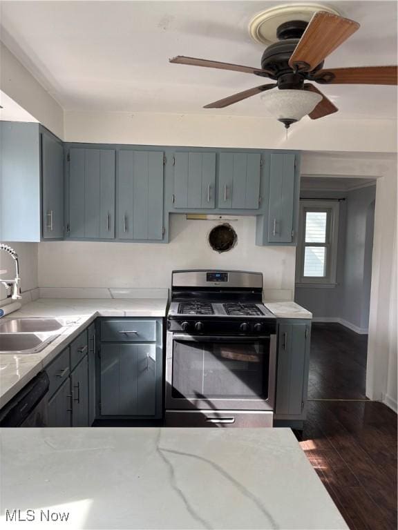 1104 S Belvoir Blvd, South Euclid, OH 44121 - kitchen with a sink, dishwasher, dark wood finished floors, stainless steel range with gas cooktop, and gray cabinetry