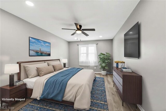 bedroom with recessed lighting, ceiling fan, baseboards, and light wood-type flooring