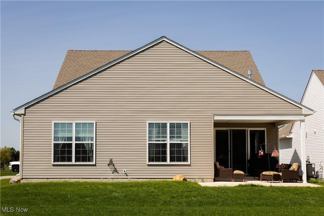 601 Cedar Crest Dr, Elyria, OH 44035 - back of house with a lawn, a patio area, and outdoor lounge area