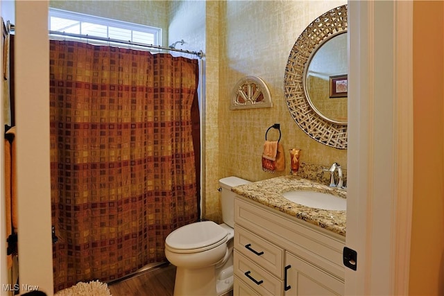 601 Cedar Crest Dr, Elyria, OH 44035 - full bath featuring vanity, curtained shower, and wood finished floors