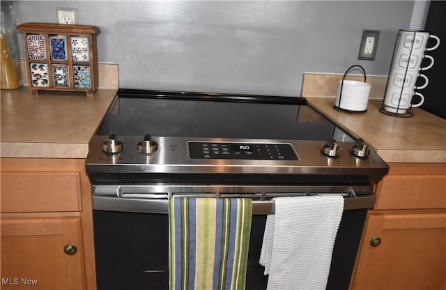 interior details with stainless steel electric range