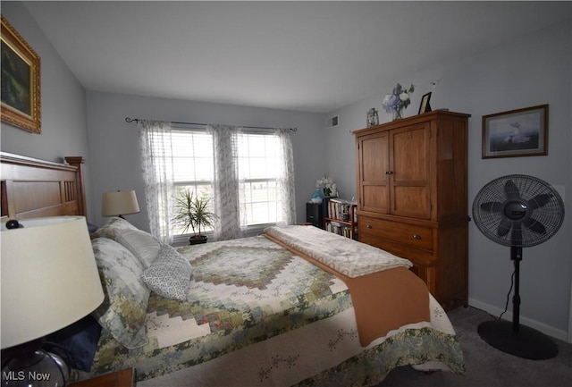 carpeted bedroom featuring baseboards and visible vents