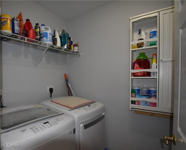 clothes washing area featuring washer and dryer