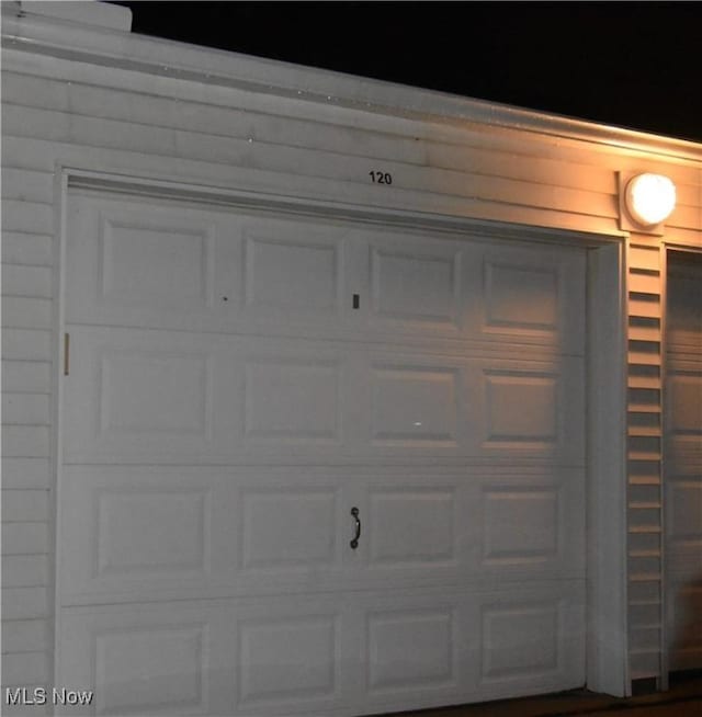 view of garage at night