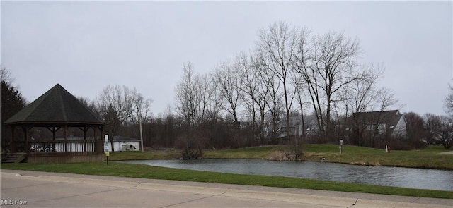 exterior space featuring a gazebo and a water view