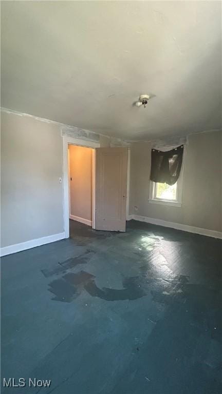 unfurnished bedroom featuring baseboards