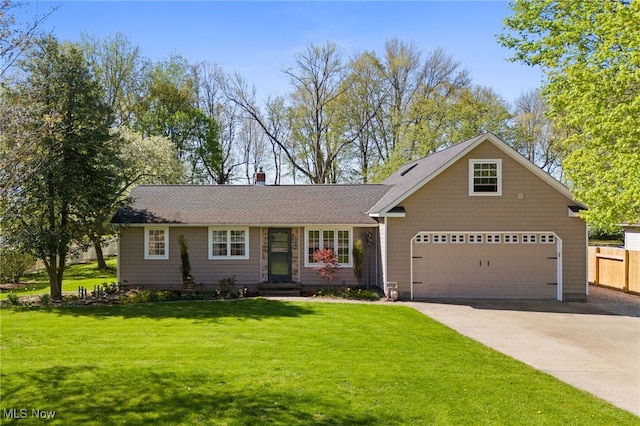 view of front of property with fence, driveway, and a front yard