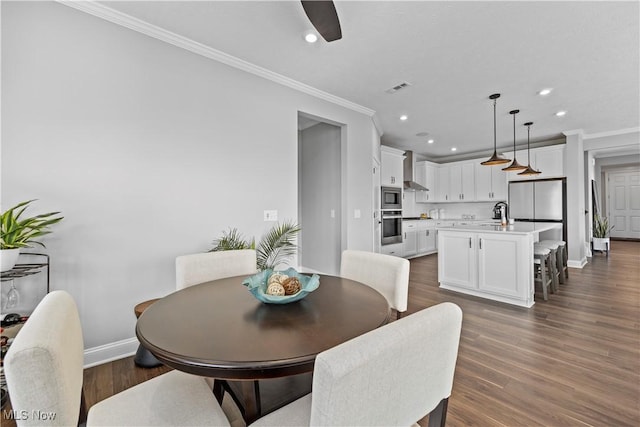 dining space featuring baseboards, ornamental molding, visible vents, and recessed lighting