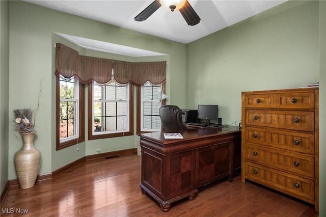 home office featuring baseboards, a ceiling fan, and wood finished floors