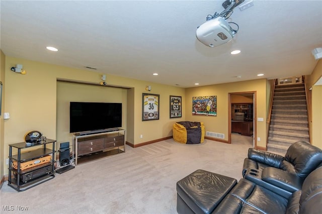 living room featuring stairway, carpet, recessed lighting, and visible vents