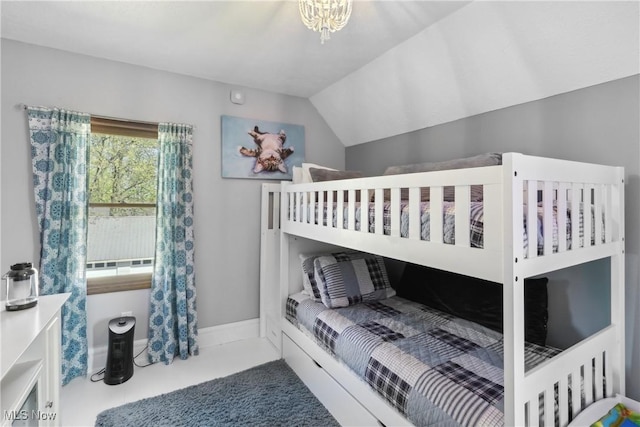bedroom featuring lofted ceiling