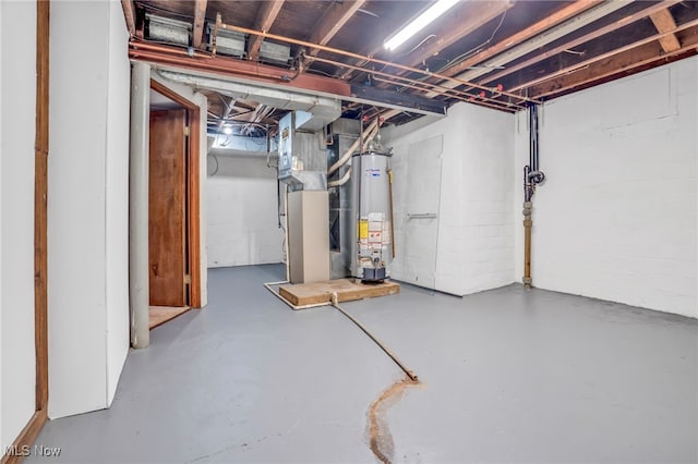 unfinished below grade area featuring water heater and heating unit