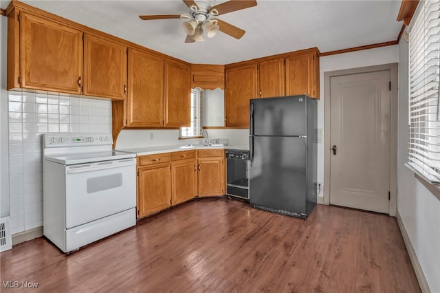 kitchen with light countertops, ceiling fan, black appliances, and brown cabinets