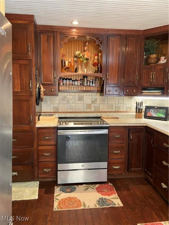 kitchen featuring open shelves, tasteful backsplash, dark wood-style flooring, and electric range