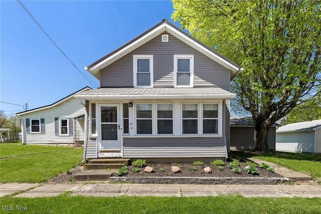 view of front of house with a front yard and entry steps