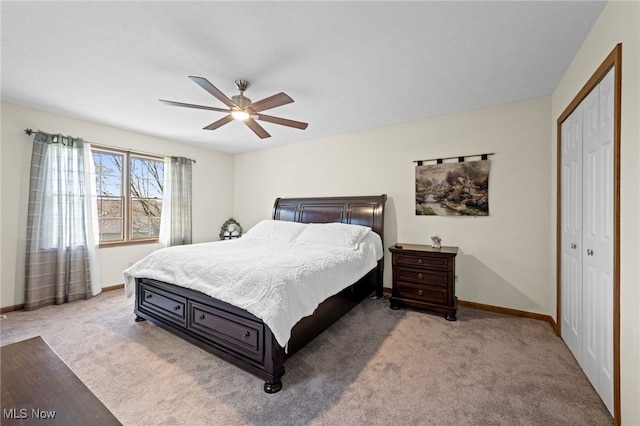 bedroom featuring a closet, carpet, ceiling fan, and baseboards