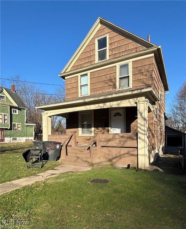 834 Kenyon St, Akron, OH 44311 - view of front of property with covered porch and a front lawn