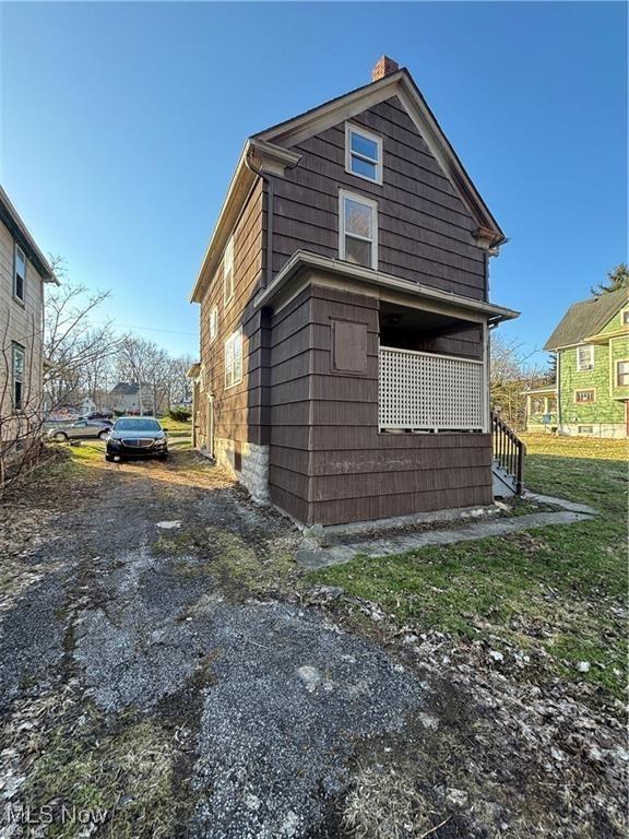 834 Kenyon St, Akron, OH 44311 - rear view of property featuring stairway and a chimney