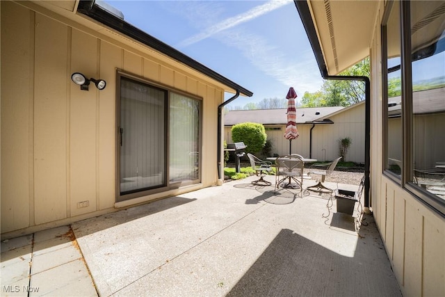 view of patio featuring outdoor dining area