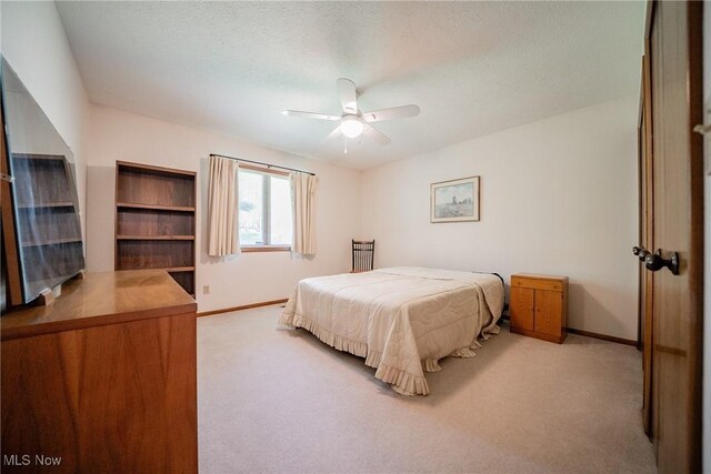 bedroom with baseboards and carpet flooring