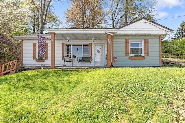 view of front of property with a porch and a front lawn