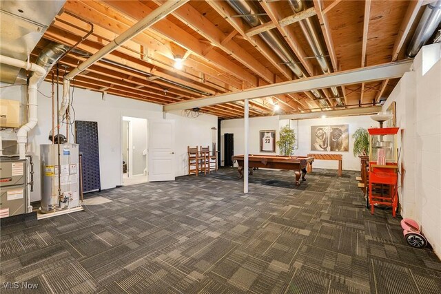 below grade area with water heater, pool table, and carpet flooring