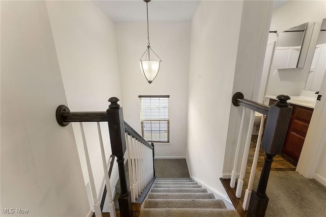 staircase with carpet flooring and baseboards
