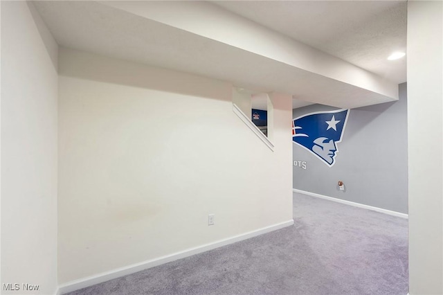 finished basement with baseboards and carpet flooring