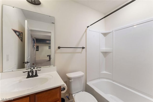 bathroom featuring vanity, shower / bathtub combination, and toilet