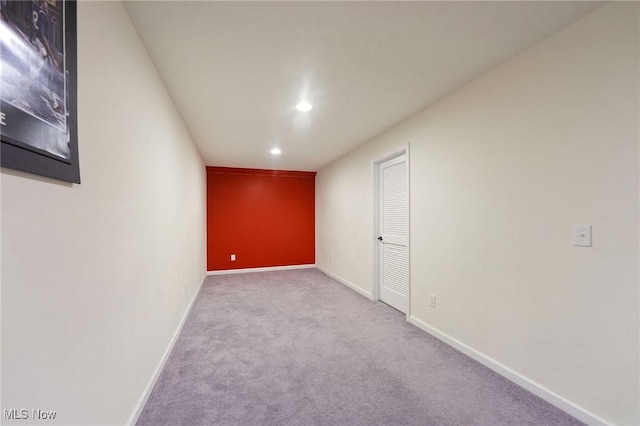 unfurnished room with baseboards, carpet flooring, and recessed lighting