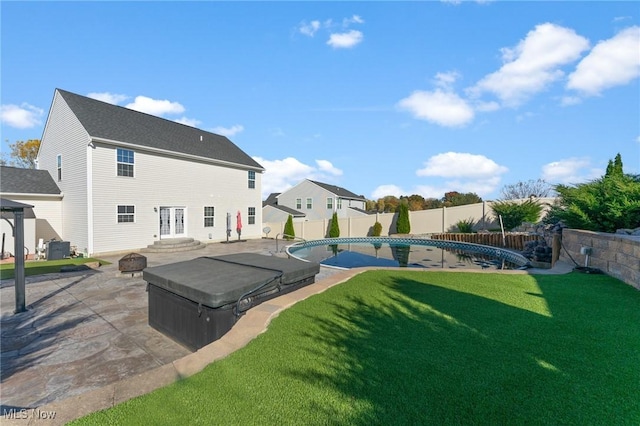 back of property featuring cooling unit, a patio, a fenced backyard, a fenced in pool, and a yard