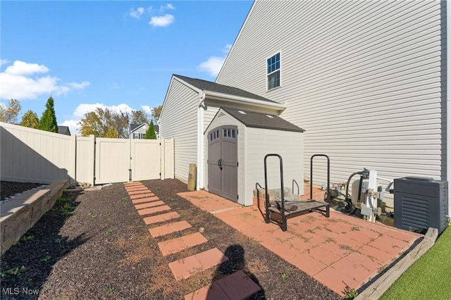exterior space featuring a fenced backyard, an outdoor structure, and a shed
