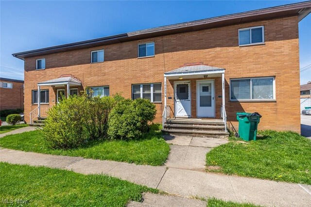 multi unit property with brick siding and entry steps