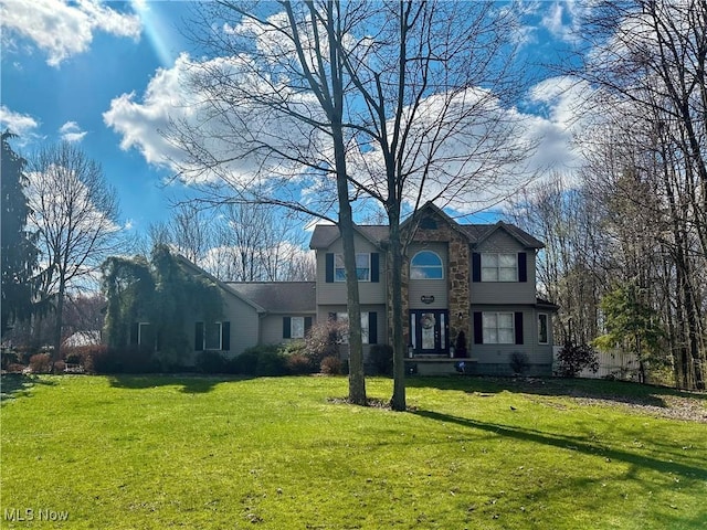 view of front of home with a front lawn