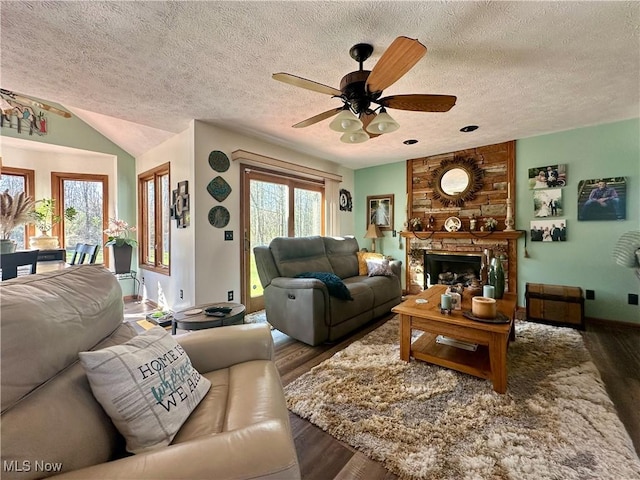 1218 Ohltown Mcdonald Rd, Mineral Ridge, OH 44440 - living room with ceiling fan, plenty of natural light, wood finished floors, and a textured ceiling