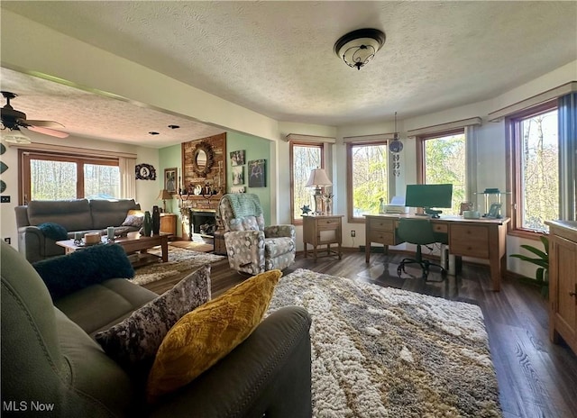 1218 Ohltown Mcdonald Rd, Mineral Ridge, OH 44440 - office space with a textured ceiling, healthy amount of natural light, dark wood-style flooring, a fireplace, and ceiling fan