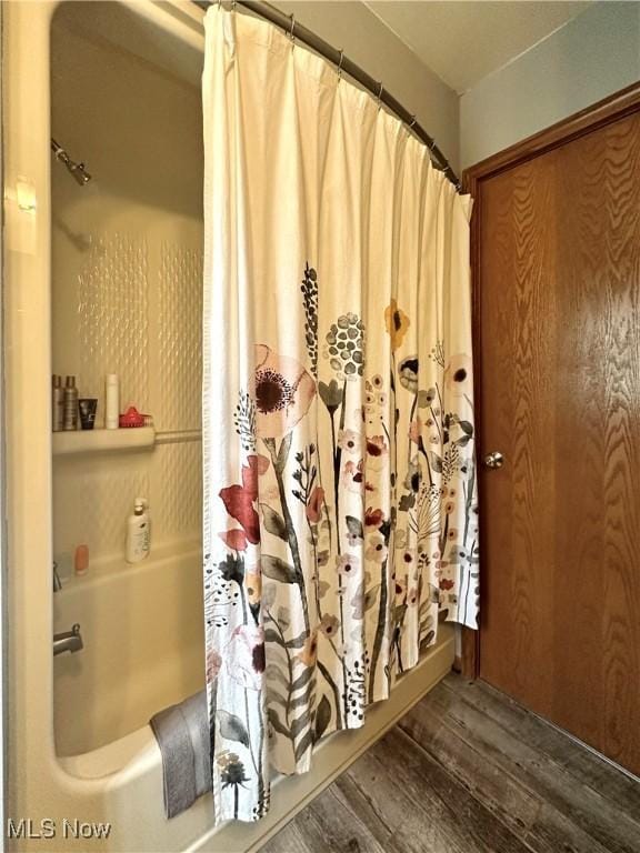 1218 Ohltown Mcdonald Rd, Mineral Ridge, OH 44440 - bathroom view of wood finished floors and shower / tub combo
