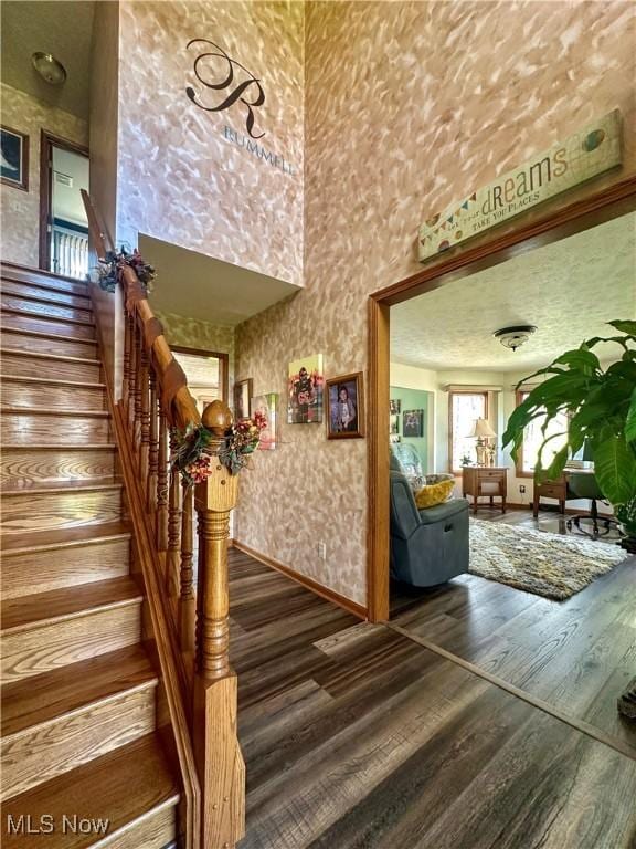 1218 Ohltown Mcdonald Rd, Mineral Ridge, OH 44440 - stairway with wood finished floors and a towering ceiling