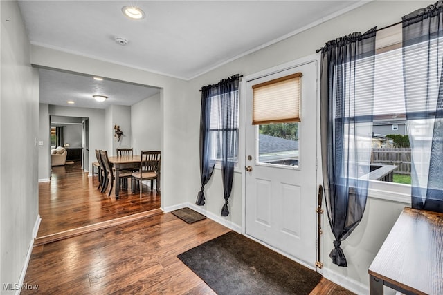 entryway featuring recessed lighting, baseboards, and wood finished floors