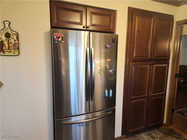 kitchen featuring freestanding refrigerator