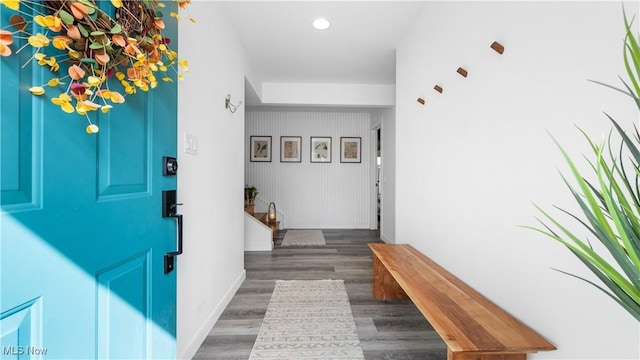 interior space with baseboards, recessed lighting, and wood finished floors
