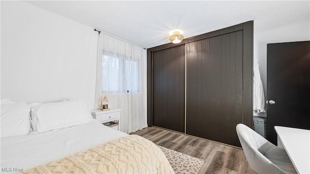 bedroom with wood finished floors