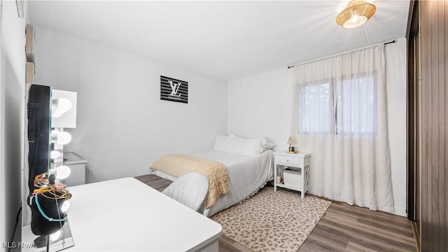 bedroom with wood finished floors