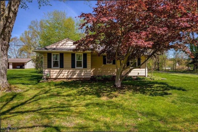 view of home's exterior with a lawn