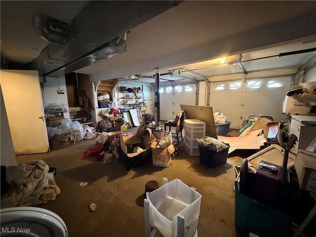 basement with heating unit and a garage