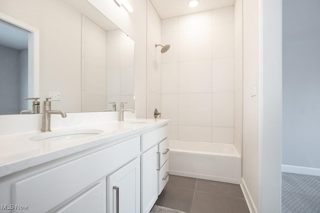 bathroom with a sink, tile patterned flooring, shower / bathing tub combination, and double vanity