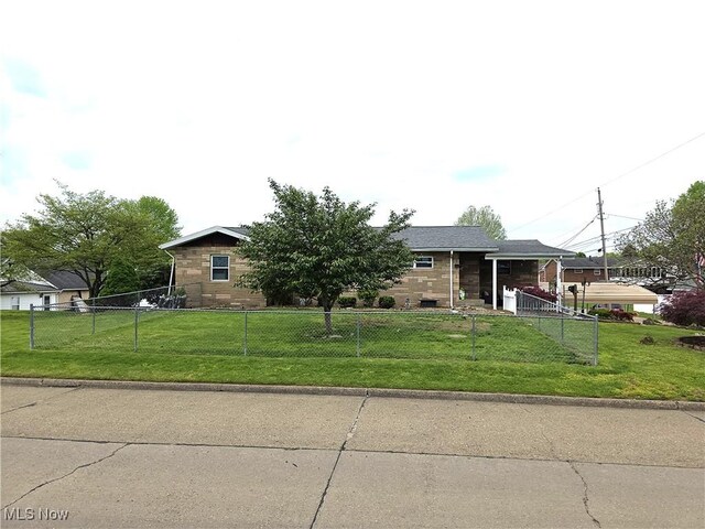 view of front of home with fence private yard and a front yard