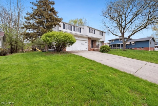 traditional-style house featuring brick siding, a garage, a front lawn, and driveway